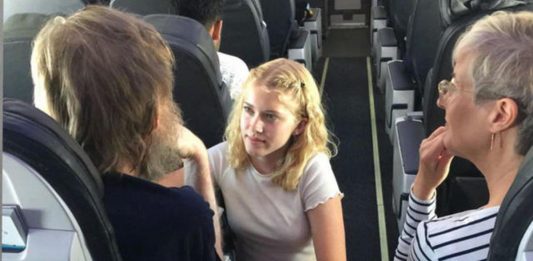 A Teenager Girl Helps a Blind and Deaf Person on a Flight